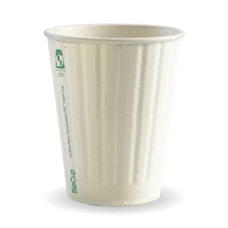 A white, ribbed White Double Wall BioCup with green eco-friendly labeling stands upright on a plain background. This 390ml BioCup is SA Compliant, making it a sustainable choice for your beverage needs.