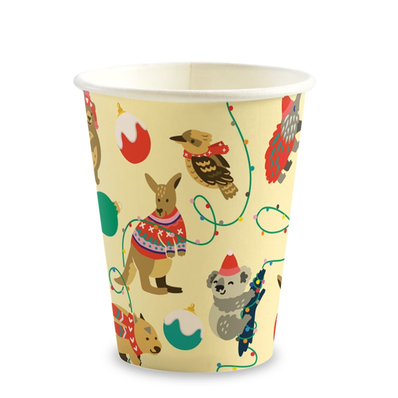 Paper cup with illustrated Australian animals in Christmas sweaters, baubles, and string lights on a light background. Made as an 8oz BioCup for festive celebrations.