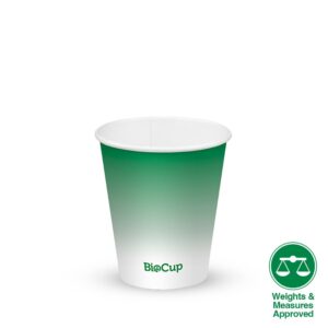 A green and white Green Cold Paper BioCup stands upright, with a "Weights & Measures Approved" symbol in the bottom right corner.