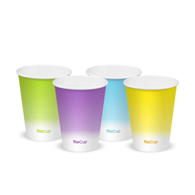 Four disposable Coloured Cold Paper BioCups in green, purple, blue, and yellow with "BioCup" branding, each 390ml BioCup capacity, arranged side by side on a white background.