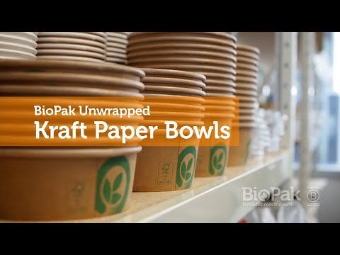 Stacks of unwrapped kraft paper bowls are arranged on a shelf, featuring "BioPak Unwrapped Kraft BioBoard Takeaway Base 1,000ml" text overlaid on the image.